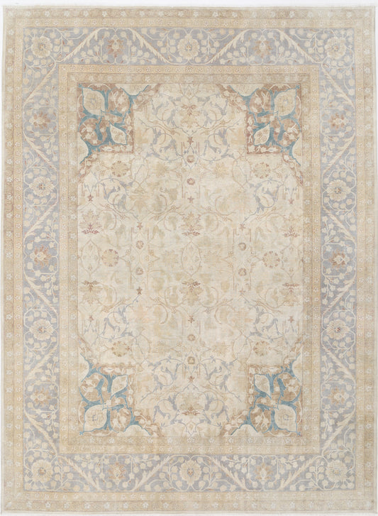 New Traditional Heritage hand-knotted wool rug measuring 8'11" x 12'1" (272 x 368 cm) in refined ivory. This exquisite wool rug showcases a timeless heritage design, expertly hand-knotted for durability and luxurious texture. Perfect for adding elegant charm to any space. Available at Artemis Rugs in Carmel, CA.