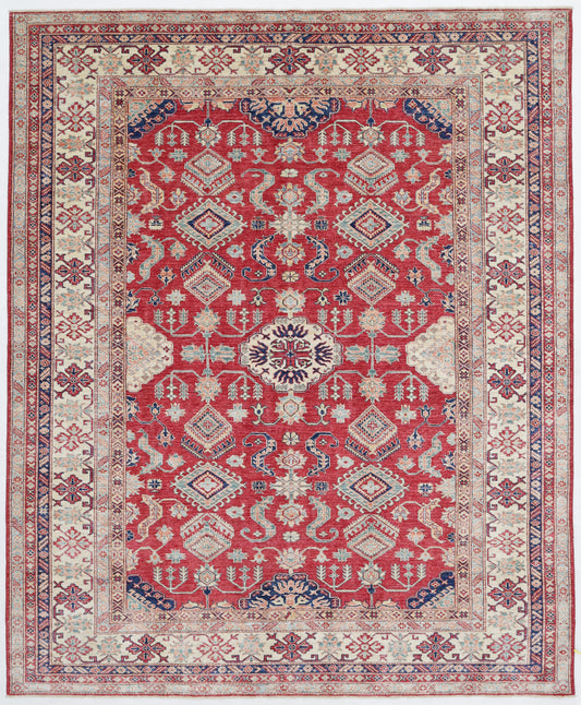 New Tribal Kazak hand-knotted wool rug 7'11" x 9'8" (241 x 295 cm) in red, from Artemis Rugs in Carmel, CA. Authentic handmade Kazak wool rug showcasing bold tribal geometric patterns and traditional Caucasian motifs. Crafted from high-quality, durable wool fibers using expert hand-knotting techniques. This vibrant red Kazak rug offers rich texture and exceptional artisan craftsmanship, perfect for collectors and enthusiasts of authentic handmade tribal wool rugs.