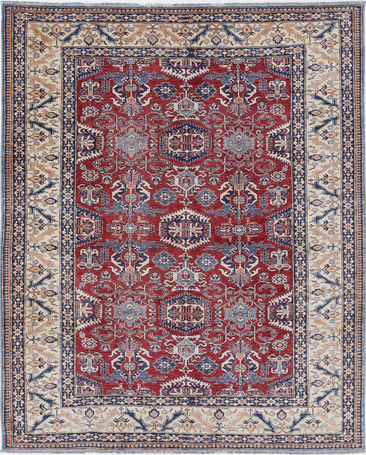New Tribal Kazak hand-knotted wool rug 7'2" x 8'10" (218 x 269 cm) in red, from Artemis Rugs in Carmel, CA. Authentic handmade Kazak wool rug featuring vibrant tribal geometric patterns and traditional Caucasian motifs. Crafted with high-quality, durable wool fibers using expert hand-knotting techniques. This red Kazak rug offers rich texture and genuine artisan craftsmanship, perfect for collectors and lovers of authentic handmade tribal wool rugs