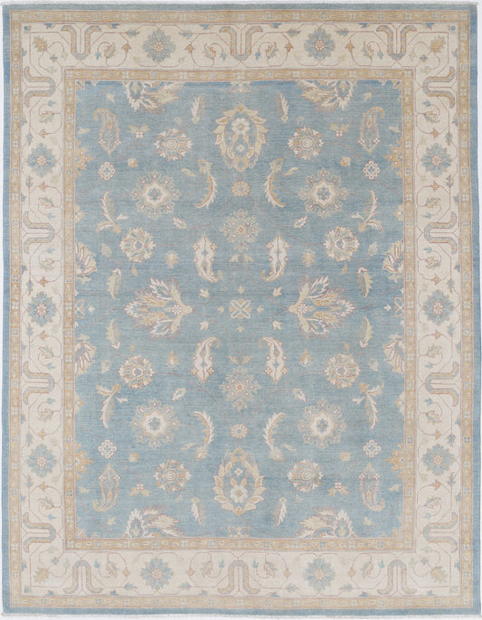 New Tribal Kazak hand-knotted wool rug 8'0" x 10'2" (244 x 310 cm) in blue, from Artemis Rugs in Carmel, CA. Authentic handmade Kazak wool rug featuring bold tribal geometric patterns and traditional Caucasian motifs. Crafted with high-quality, durable wool fibers using expert hand-knotting techniques. This blue Kazak rug offers rich texture and vibrant artisan craftsmanship, perfect for collectors and enthusiasts of authentic handmade tribal wool rugs.