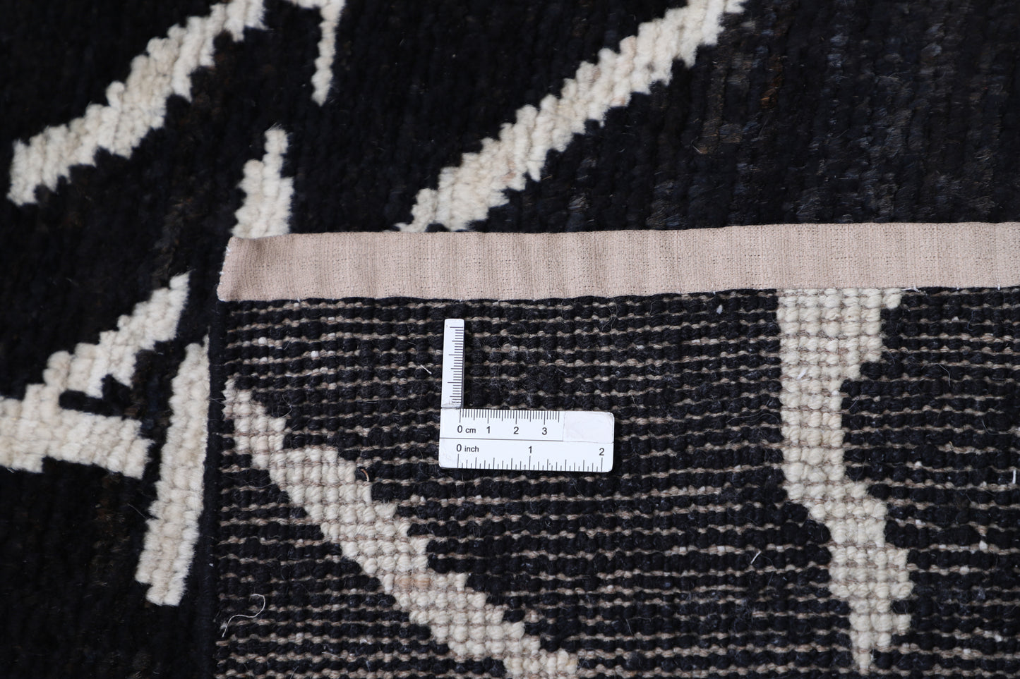 New Tribal Moroccan hand-knotted wool rug (6 ft 0 in × 9 ft 3 in) featuring bold geometric tribal designs in warm earthy tones, crafted with artisan skill—available at Artemis Rugs in Carmel, California