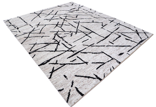 New Tribal Moroccan hand-knotted wool rug (8 ft 3 in × 9 ft 9 in) featuring vibrant geometric tribal designs in warm earthy tones, handcrafted with expert skill—available at Artemis Rugs in Carmel, California