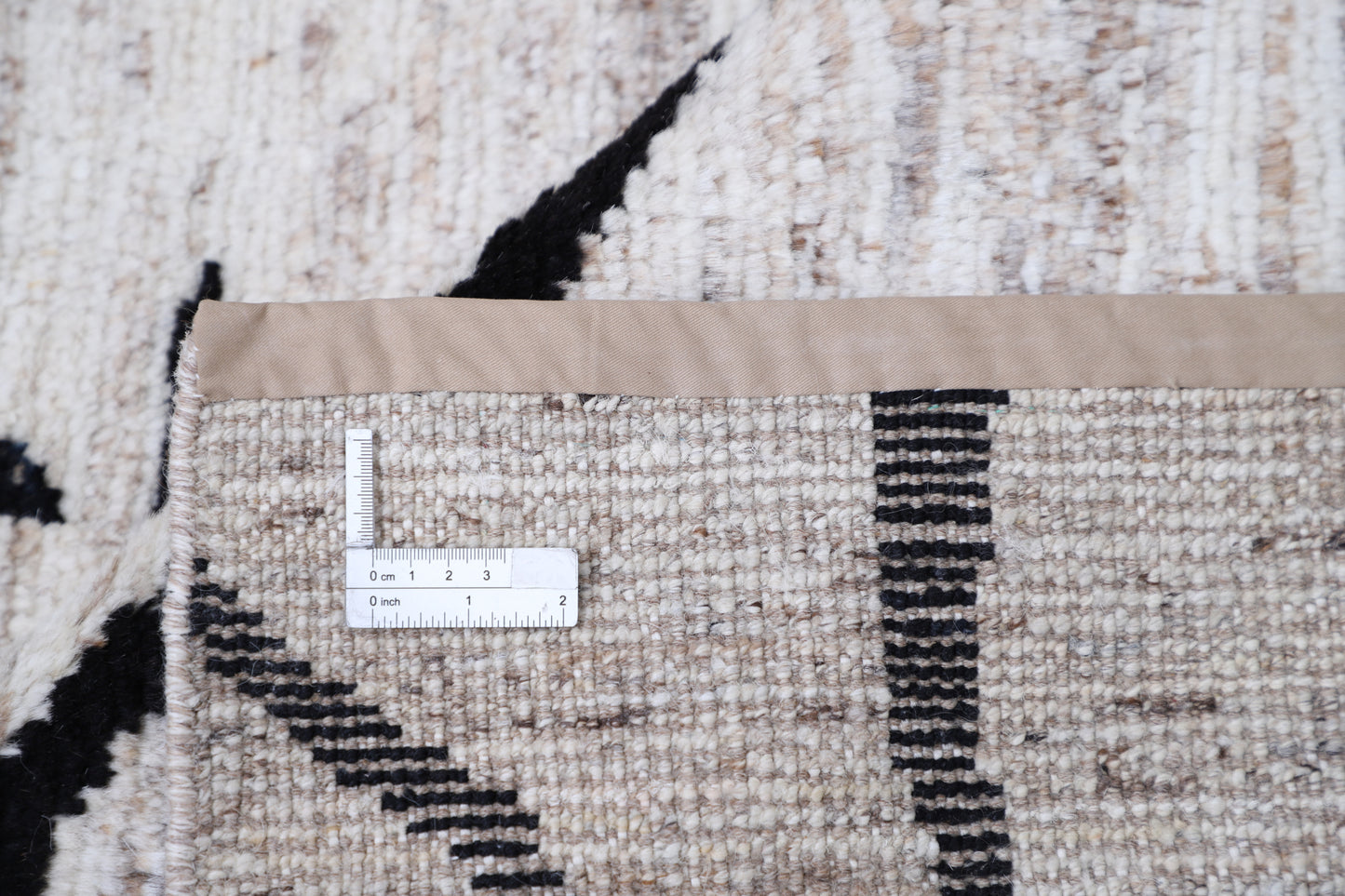 New Tribal Moroccan hand-knotted wool rug (8 ft 3 in × 9 ft 9 in) featuring vibrant geometric tribal designs in warm earthy tones, handcrafted with expert skill—available at Artemis Rugs in Carmel, California