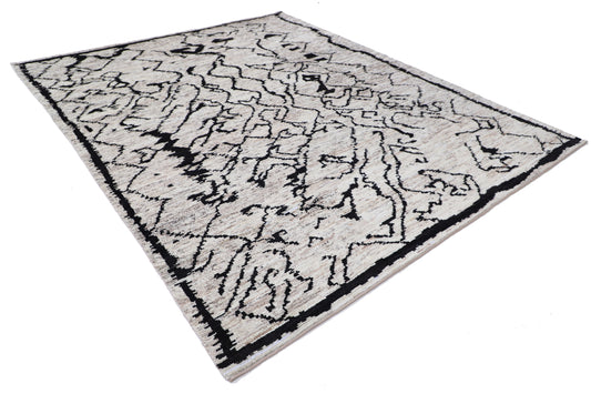 New Tribal Moroccan hand-knotted wool rug (8 ft 2 in × 9 ft 9 in) featuring bold geometric tribal patterns in warm earthy tones, handcrafted with artisan skill—available at Artemis Rugs in Carmel, California.