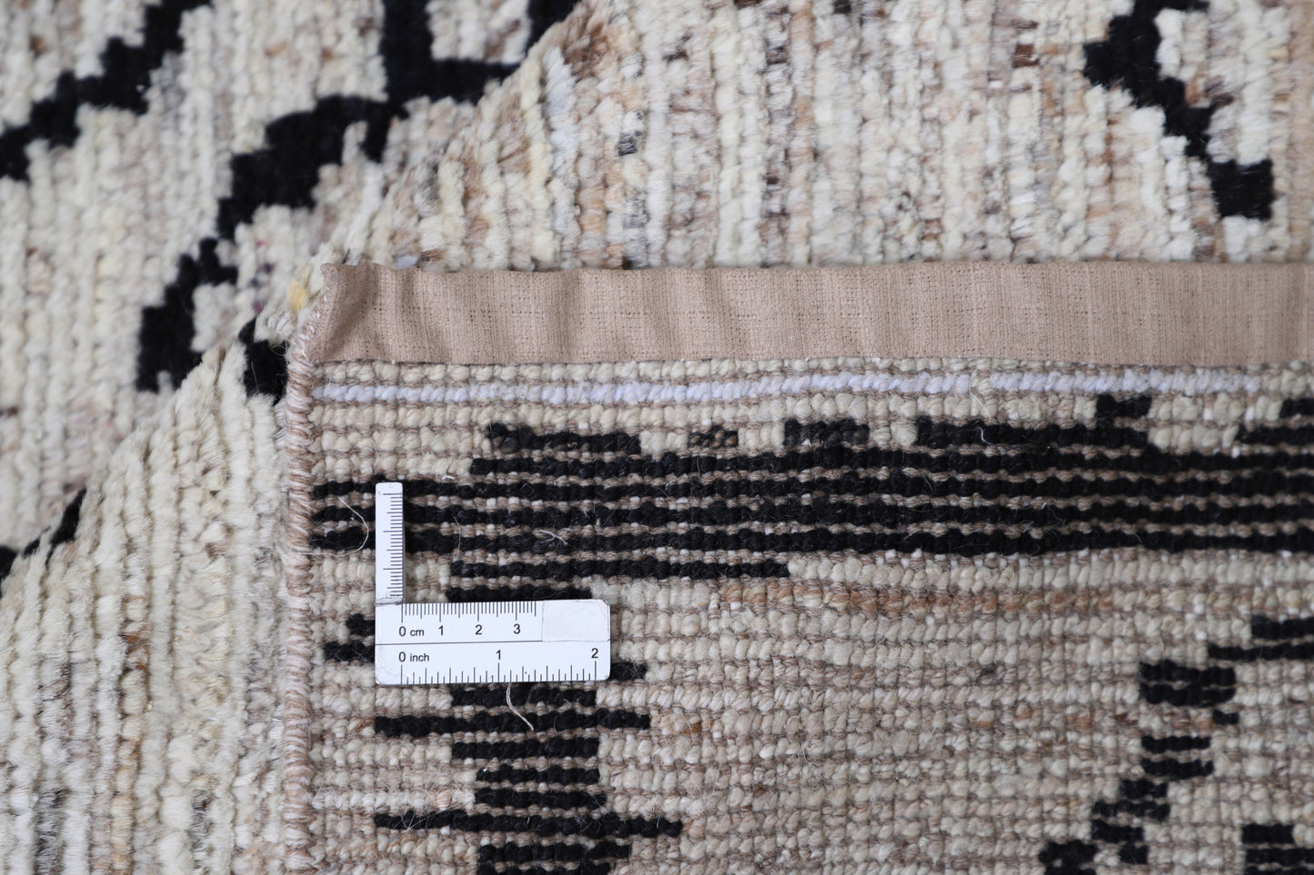 New Tribal Moroccan hand-knotted wool rug (8 ft 2 in × 9 ft 9 in) featuring bold geometric tribal patterns in warm earthy tones, handcrafted with artisan skill—available at Artemis Rugs in Carmel, California.