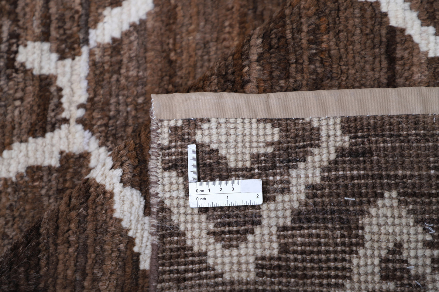 New Tribal Moroccan hand-knotted wool rug (8 ft 4 in × 10 ft 4 in) showcasing bold geometric tribal patterns in warm earthy tones, handcrafted with artisan skill—available at Artemis Rugs in Carmel, California