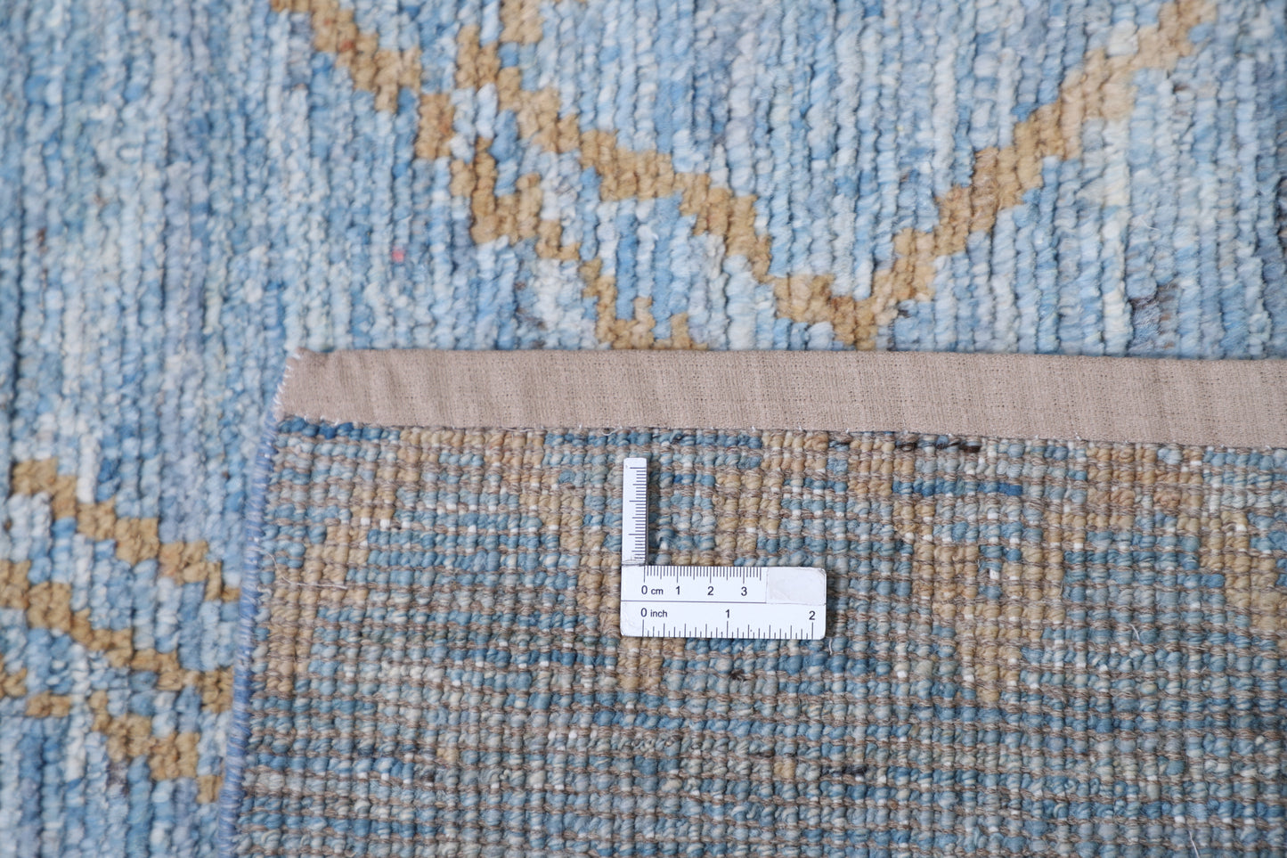 New Tribal Moroccan hand-knotted wool runner rug (3 ft 4 in × 11 ft 8 in) featuring bold geometric tribal patterns in warm earthy tones, handcrafted with artisan skill—available at Artemis Rugs in Carmel, California