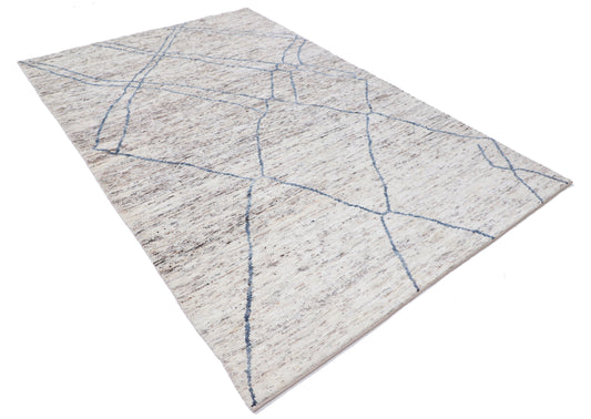 "New Tribal Moroccan hand-knotted wool rug 5'10" x 9'0" from Artemis Rugs in Carmel, CA. Authentic handwoven wool rug showcasing traditional Moroccan tribal patterns with intricate detailing. Made from high-quality, durable wool fibers using expert hand-knotting techniques. Unique tribal design reflects genuine Moroccan craftsmanship, offering both texture and long-lasting beauty. Ideal for collectors and lovers of handmade tribal rugs.