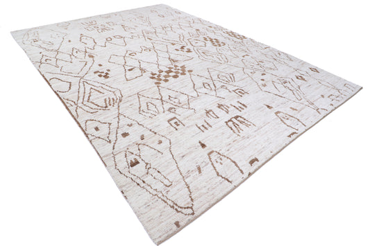 New Tribal Moroccan hand-knotted wool rug 8'9" x 12'2" from Artemis Rugs in Carmel, CA. Authentic handmade wool rug featuring intricate tribal Moroccan patterns and traditional hand-knotting techniques. Crafted from high-quality, durable wool fibers, this rug showcases unique tribal designs reflecting genuine Moroccan artisan craftsmanship. Soft, textured, and built to last, perfect for collectors and enthusiasts of authentic handmade tribal rugs