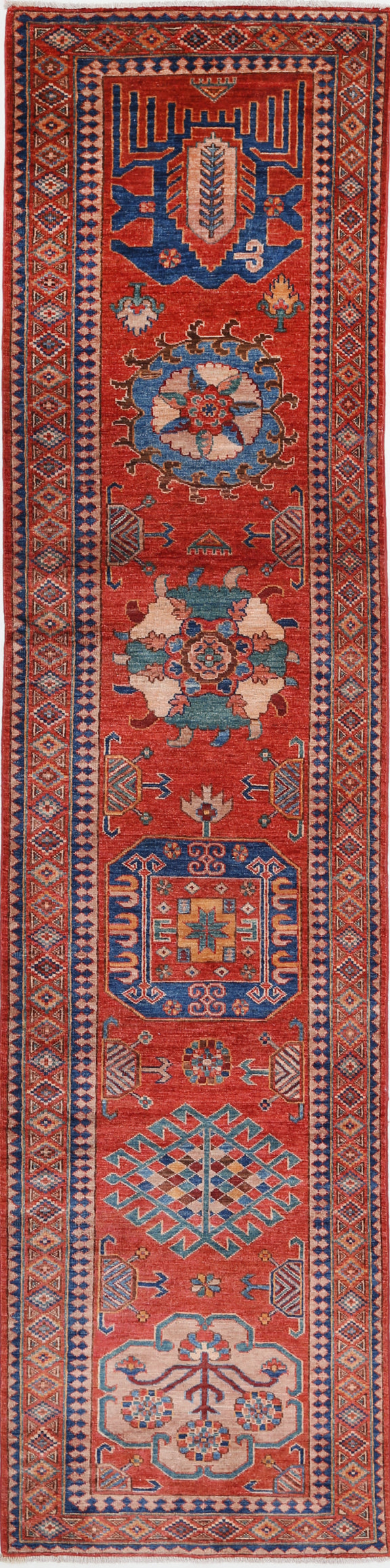 "New Tribal Humna hand-knotted wool rug 2'8" x 11'6" (81 x 351 cm) in red, from Artemis Rugs in Carmel, CA. Authentic handmade Humna wool runner featuring vibrant tribal patterns and traditional geometric motifs. Crafted with high-quality, durable wool fibers using expert hand-knotting techniques. This red Humna rug offers rich texture and genuine artisan craftsmanship, ideal for collectors and lovers of authentic handmade tribal wool rugs."